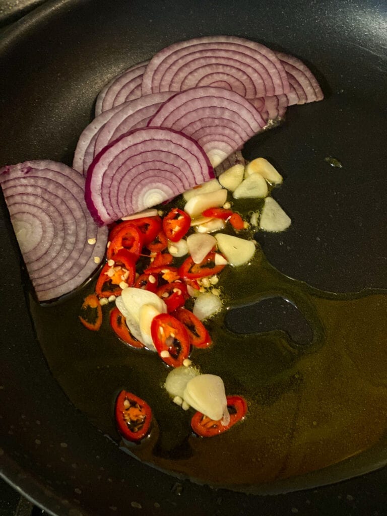 olive oi with onions, garlic and chilis