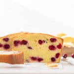 cranberry orange pound cake loaf with slices of cake